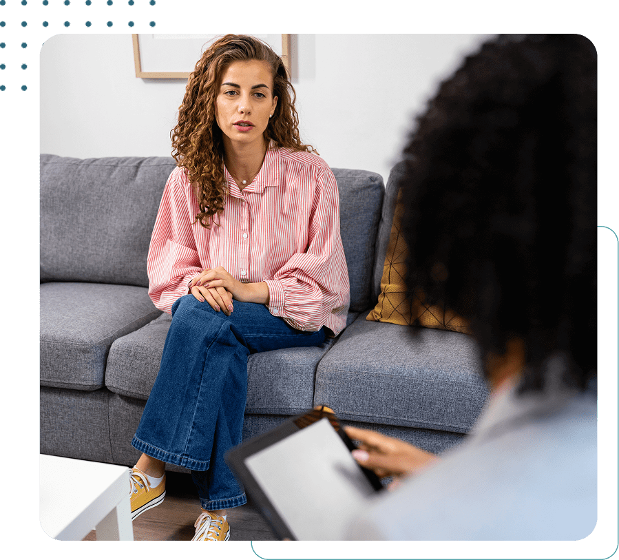 Woman in therapy session on a couch.