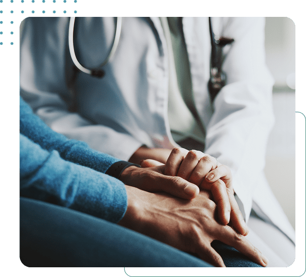 Doctor comforting patient with supportive gesture.