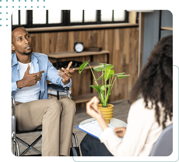 Man talking to a woman in office.
