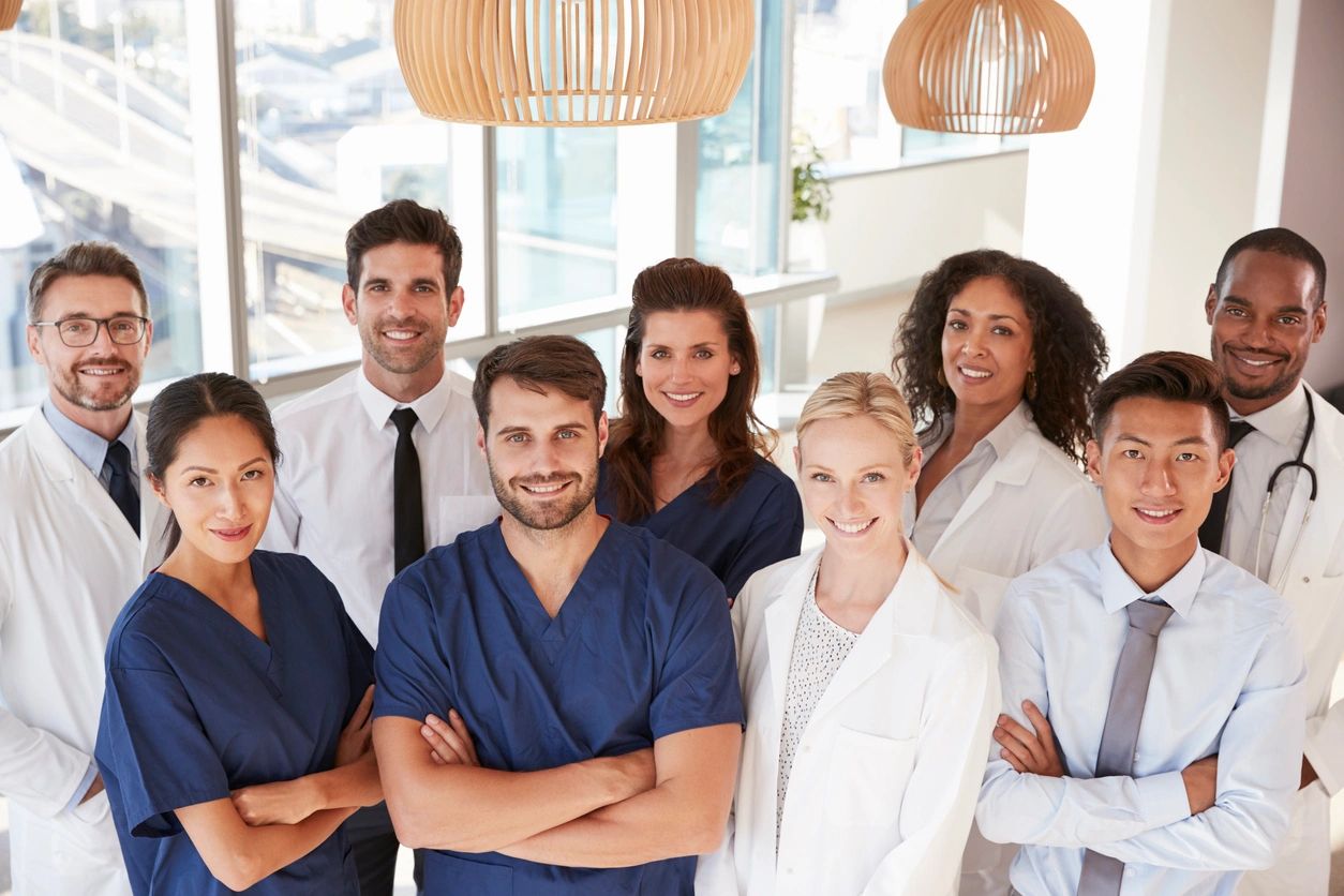 Group of diverse healthcare professionals smiling together.